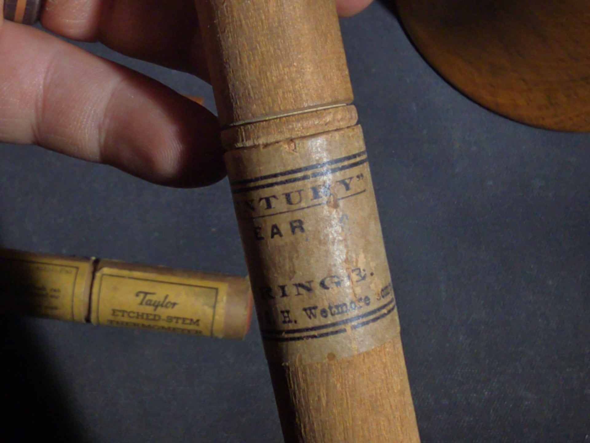 Grouping of Eight Antique, Vintage, and Modern Wooden Smalls Including Hughes "The Shoe Man" Advertising Shoehorn from Dover, New Hampshire, Turned Bowl Signed Jason Szafranski, Taylor Etched-Stem Thermometer, and "Century" Ear Syringe Case
