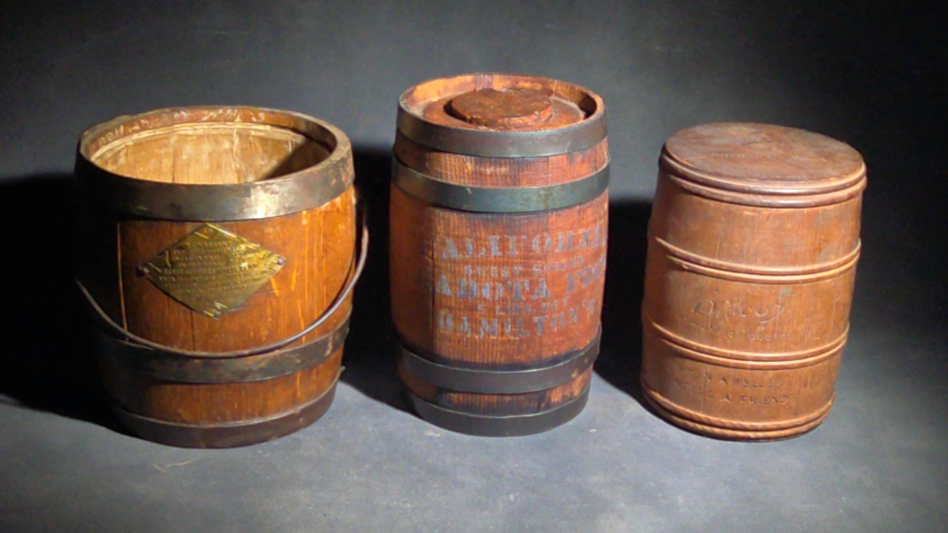 Trio of Antique Wooden Advertising Containers including F.W. Devoe & Co. White Lead Bucket with Brass Plaque, Hamilton's California Kadota Figs Barrel, and Briggs Smoking Tobacco Barrel