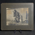 Lot 085 - Antique Board-Mounted "Selfie" Photograph of Three Hunters with Rifles and Game Posed Outside a Wooden Building, Self-Timed Shutter Release