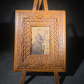 Lot 031 - Antique Chip-Carved Folk Art Easel Picture Frame with Photograph of a Seated Young Woman, 9-1/4" W x 15" H