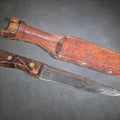 Lot 091 - Vintage Herter's Inc. Fixed Blade Knife with Wood Handle and Tooled Leather Sheath, 10" L