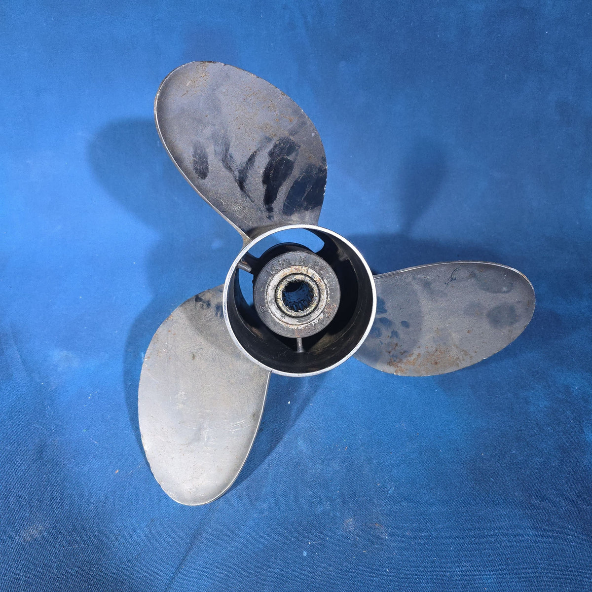 Pair of Vintage Three-Blade Boat Propellers including a Michigan Wheel Vortex Four-Blade and a Stainless Steel Three-Blade