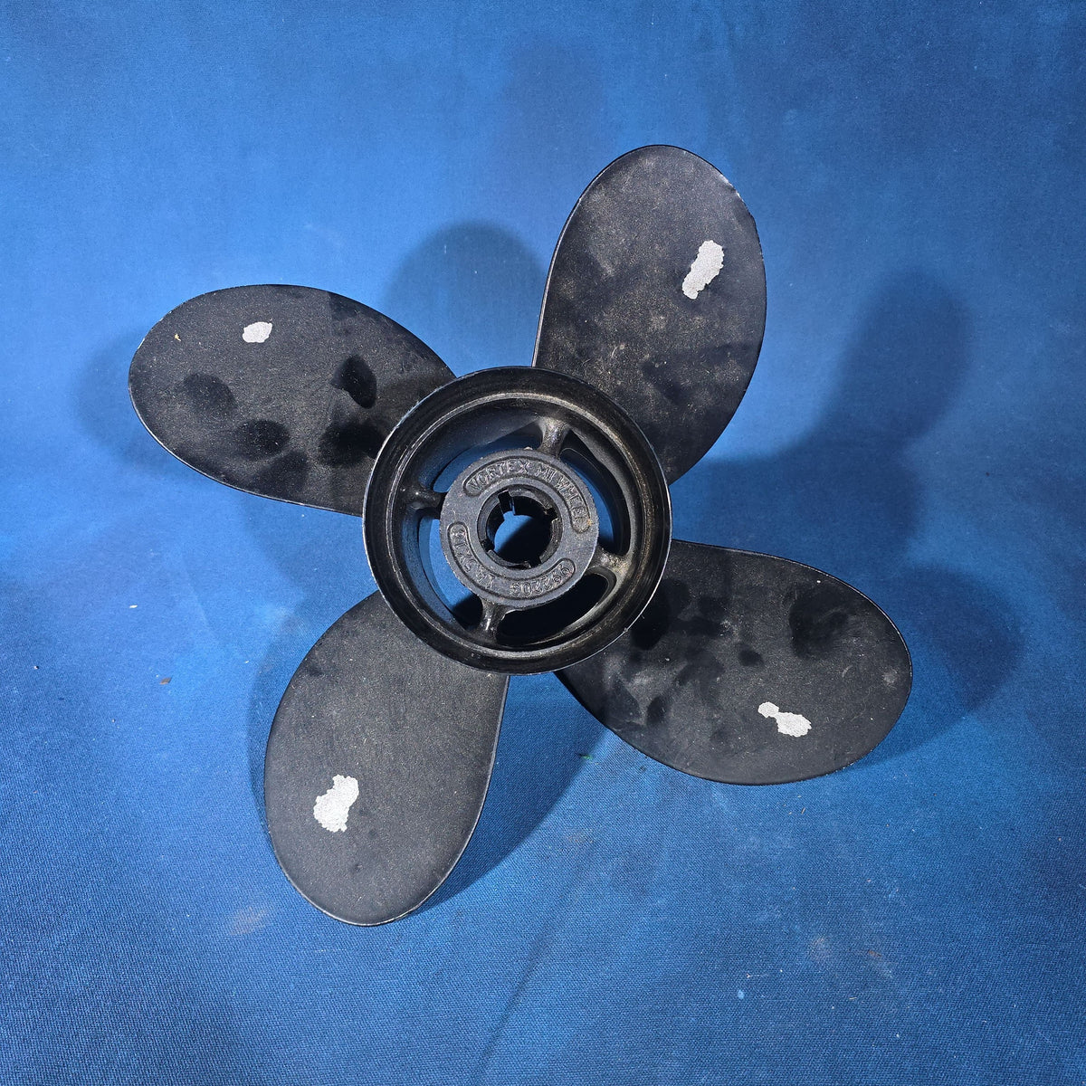 Pair of Vintage Three-Blade Boat Propellers including a Michigan Wheel Vortex Four-Blade and a Stainless Steel Three-Blade