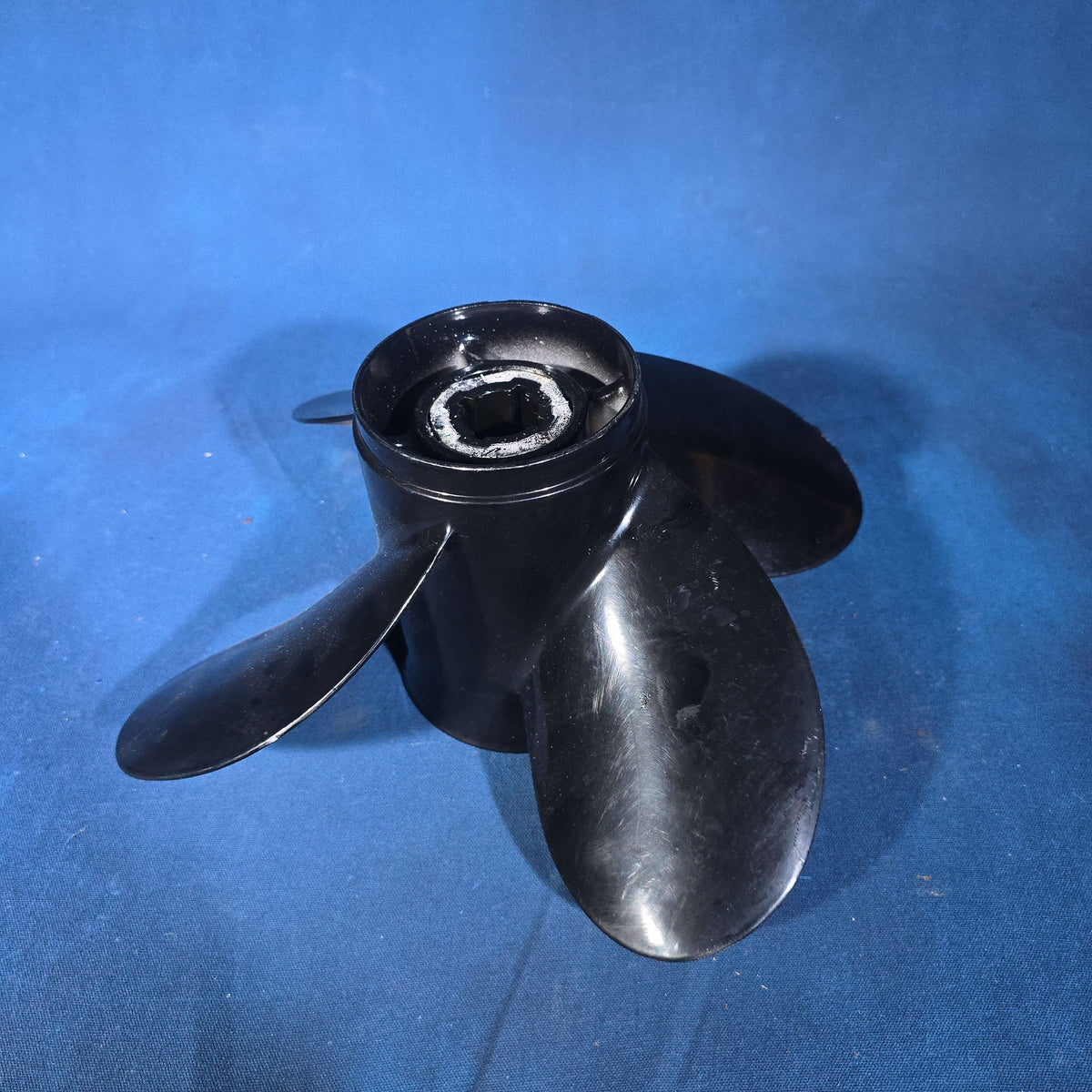 Pair of Vintage Three-Blade Boat Propellers including a Michigan Wheel Vortex Four-Blade and a Stainless Steel Three-Blade