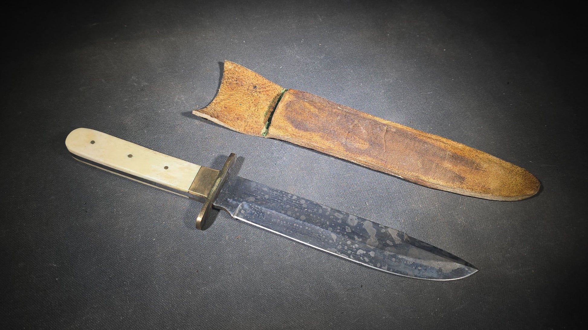 Antique Bowie-Style Knife with Bone Handle Scales, Brass Crossguard, and Leather Sheath