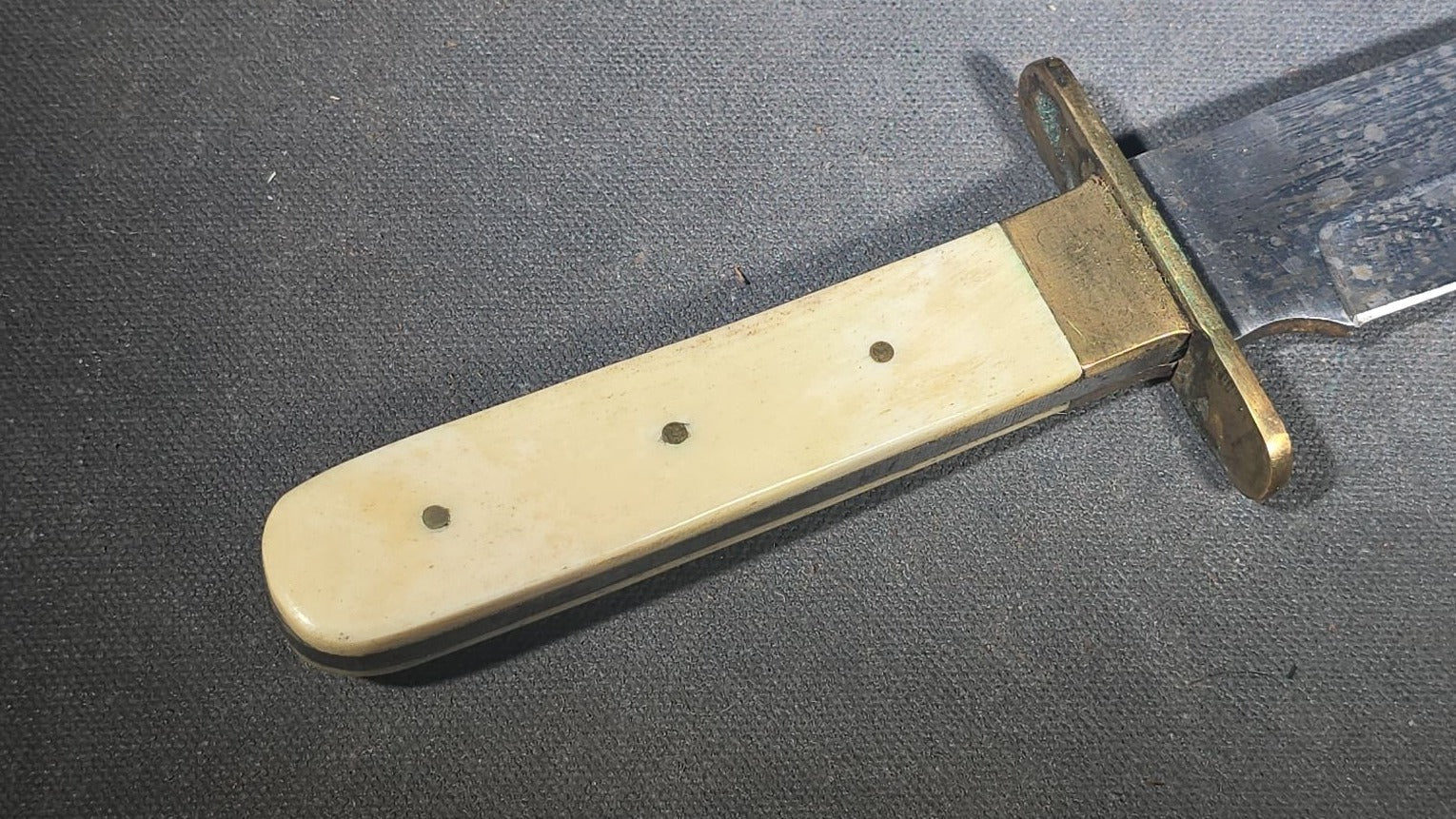 Antique Bowie-Style Knife with Bone Handle Scales, Brass Crossguard, and Leather Sheath