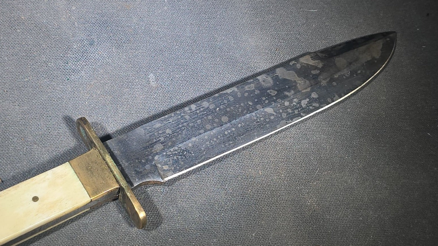 Antique Bowie-Style Knife with Bone Handle Scales, Brass Crossguard, and Leather Sheath