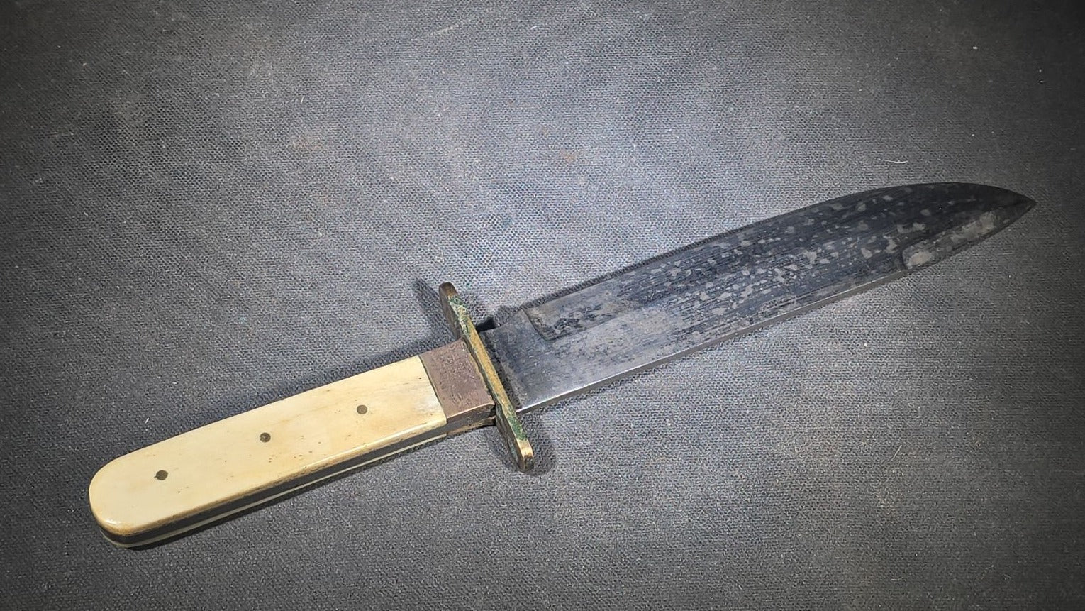 Antique Bowie-Style Knife with Bone Handle Scales, Brass Crossguard, and Leather Sheath