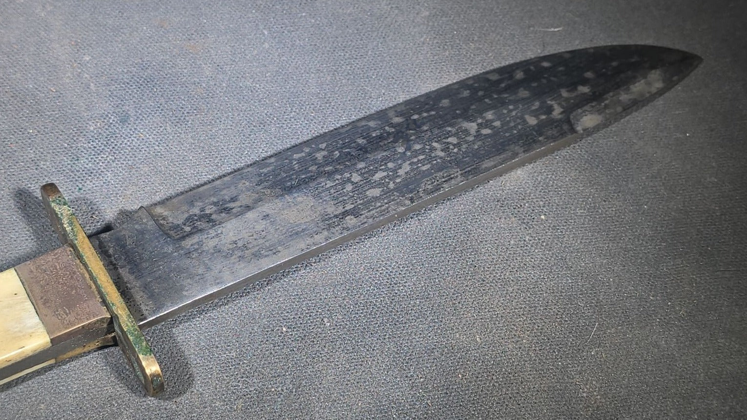 Antique Bowie-Style Knife with Bone Handle Scales, Brass Crossguard, and Leather Sheath