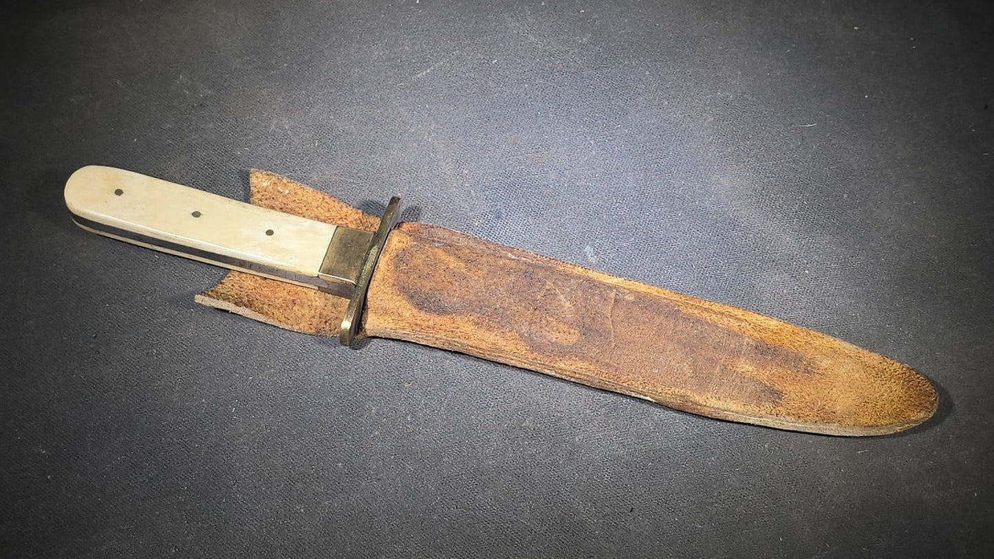 Antique Bowie-Style Knife with Bone Handle Scales, Brass Crossguard, and Leather Sheath