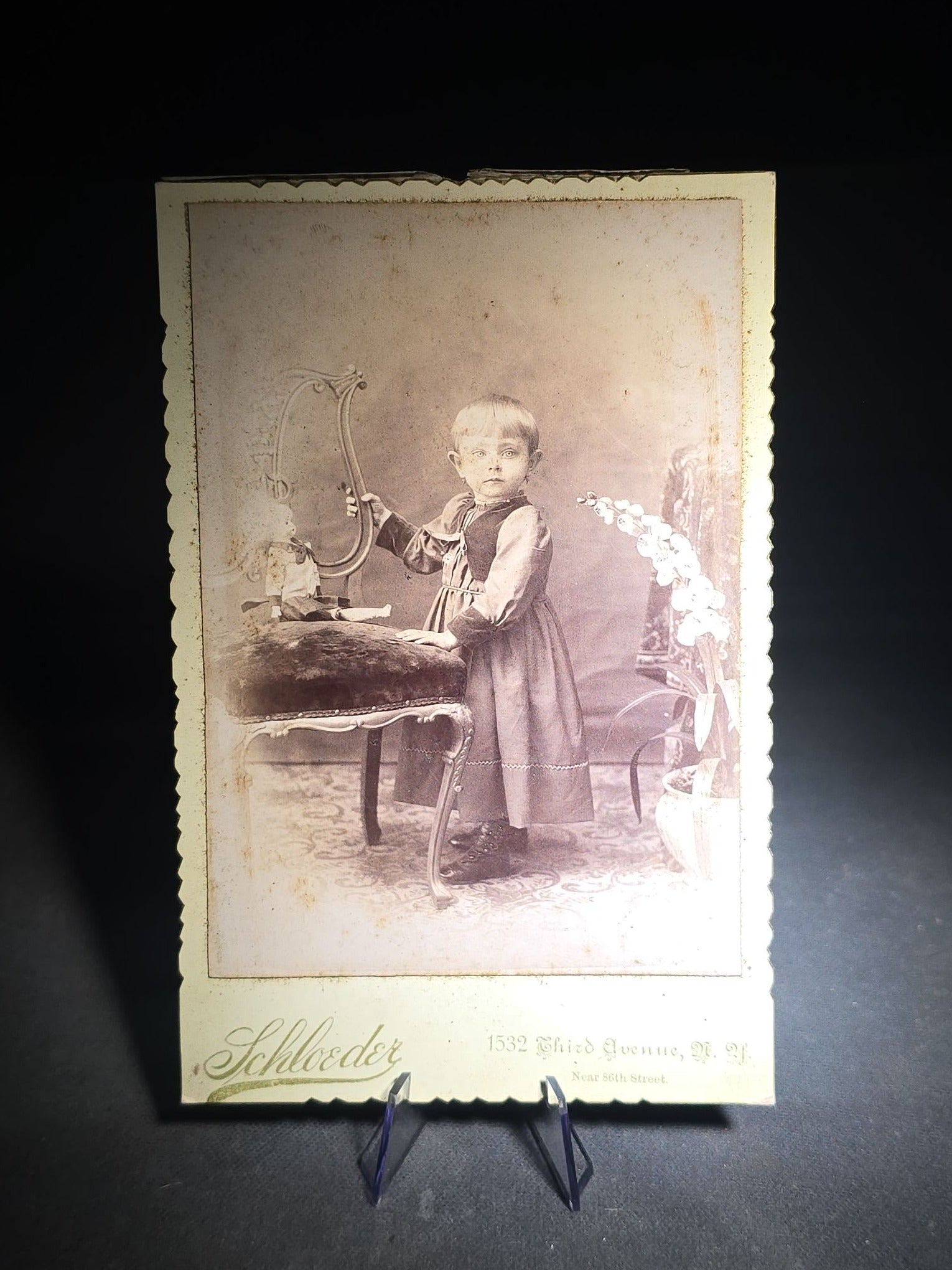 Grouping of 12 Antique and Vintage Photographs including Crescent Moon Snapshot, Rock Formation C.D.V., Child with Doll Cabinet Card by Schloeder, and Girl with Hoop Cabinet Card by Neale, Tremont, New York