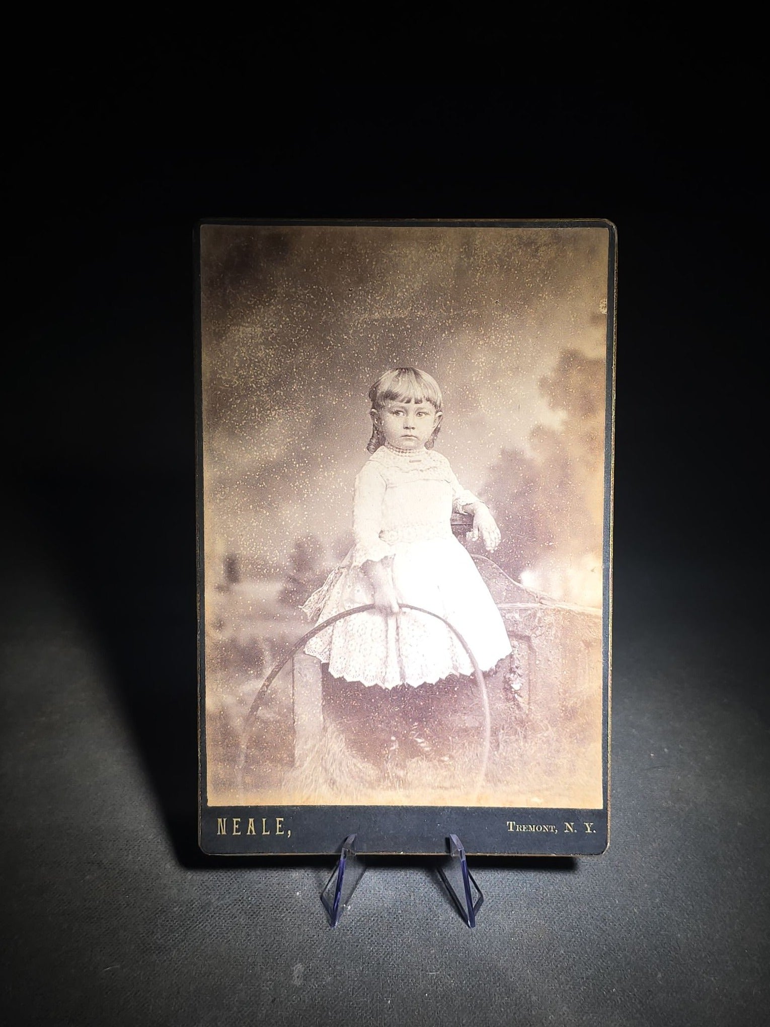 Grouping of 12 Antique and Vintage Photographs including Crescent Moon Snapshot, Rock Formation C.D.V., Child with Doll Cabinet Card by Schloeder, and Girl with Hoop Cabinet Card by Neale, Tremont, New York