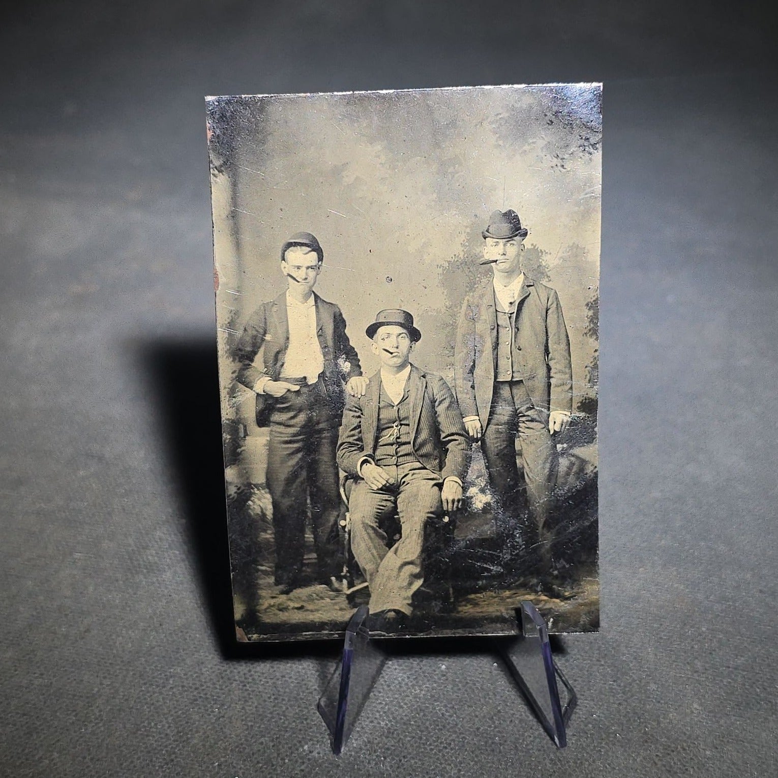 Grouping of Four Antique Tintype Photographs Including Two Seated Men with Pencil Inscription and Three Men in Top Hats