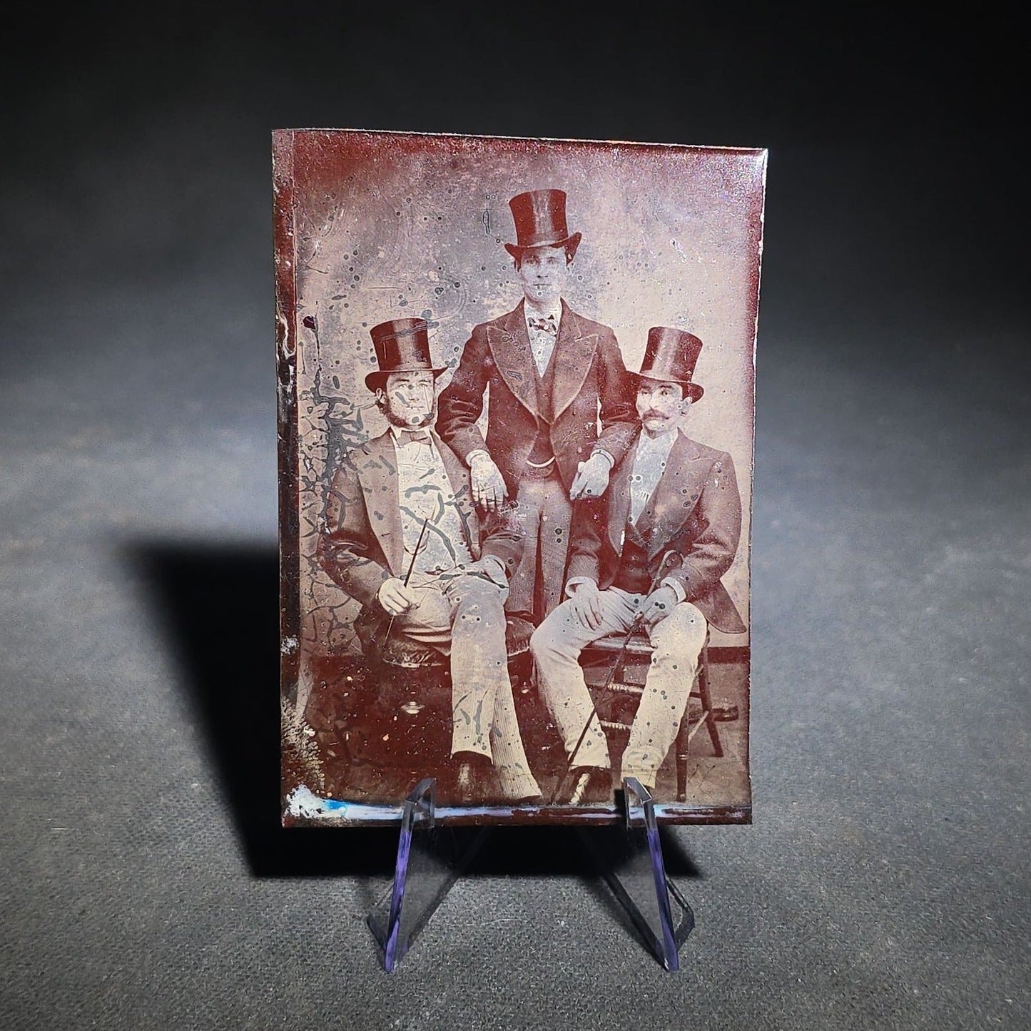 Grouping of Four Antique Tintype Photographs Including Two Seated Men with Pencil Inscription and Three Men in Top Hats
