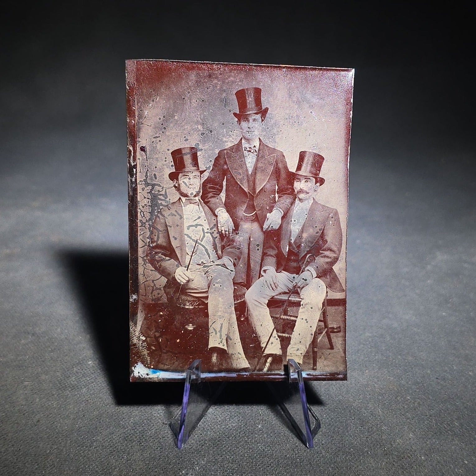 Grouping of Four Antique Tintype Photographs Including Two Seated Men with Pencil Inscription and Three Men in Top Hats