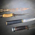 Lot 099 - Grouping of Four Vintage Fixed-Blade Knives Including Marble's Stacked Leather Handle Knife, Stag Handle Knife, and Bone Handle Dagger
