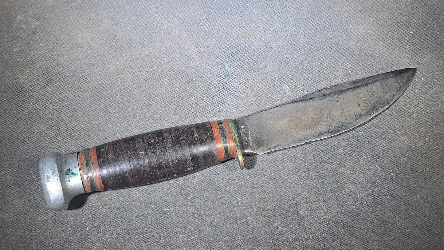 Grouping of Four Vintage Fixed-Blade Knives including Marble's Stacked Leather Handle Knife, Stag Handle Knife, and Bone Handle Dagger