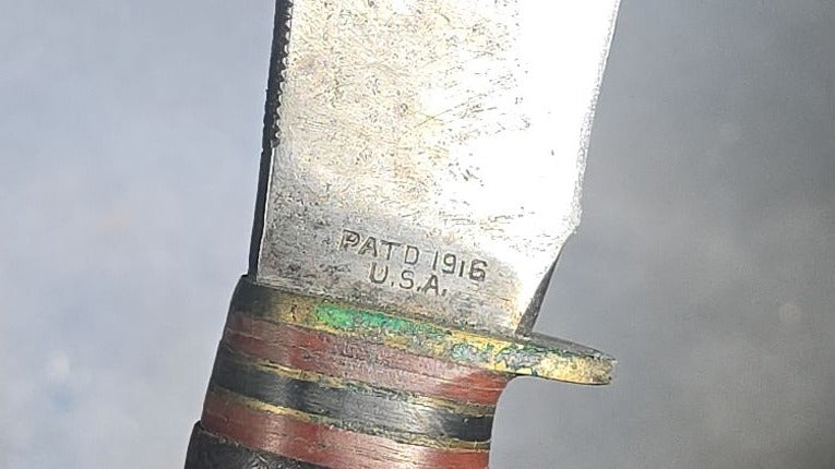 Grouping of Four Vintage Fixed-Blade Knives including Marble's Stacked Leather Handle Knife, Stag Handle Knife, and Bone Handle Dagger
