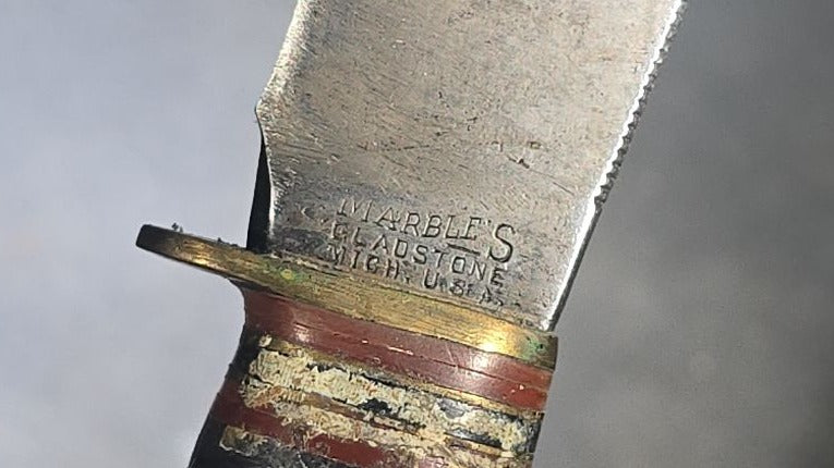 Grouping of Four Vintage Fixed-Blade Knives including Marble's Stacked Leather Handle Knife, Stag Handle Knife, and Bone Handle Dagger