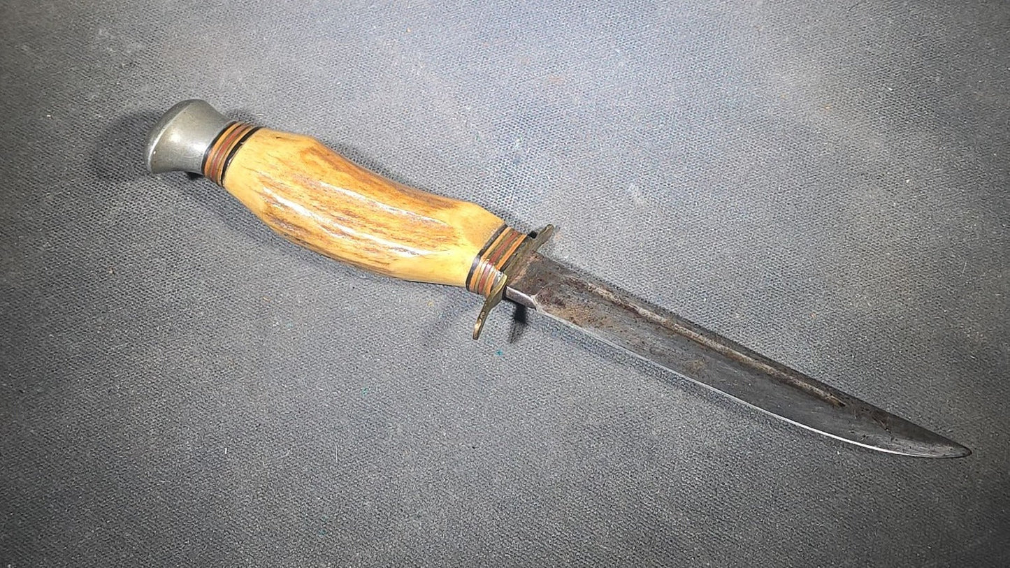Grouping of Four Vintage Fixed-Blade Knives including Marble's Stacked Leather Handle Knife, Stag Handle Knife, and Bone Handle Dagger