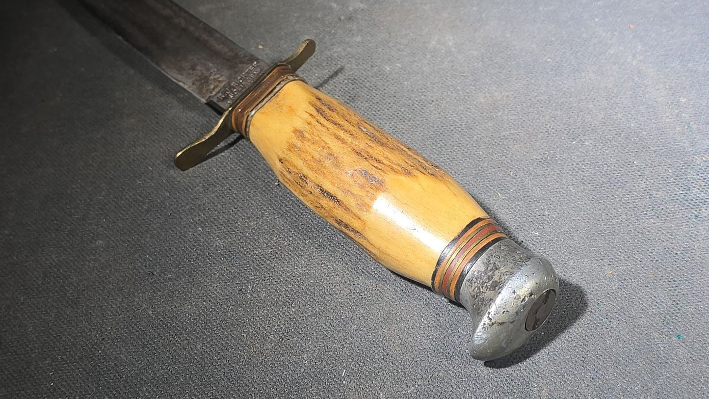 Grouping of Four Vintage Fixed-Blade Knives including Marble's Stacked Leather Handle Knife, Stag Handle Knife, and Bone Handle Dagger