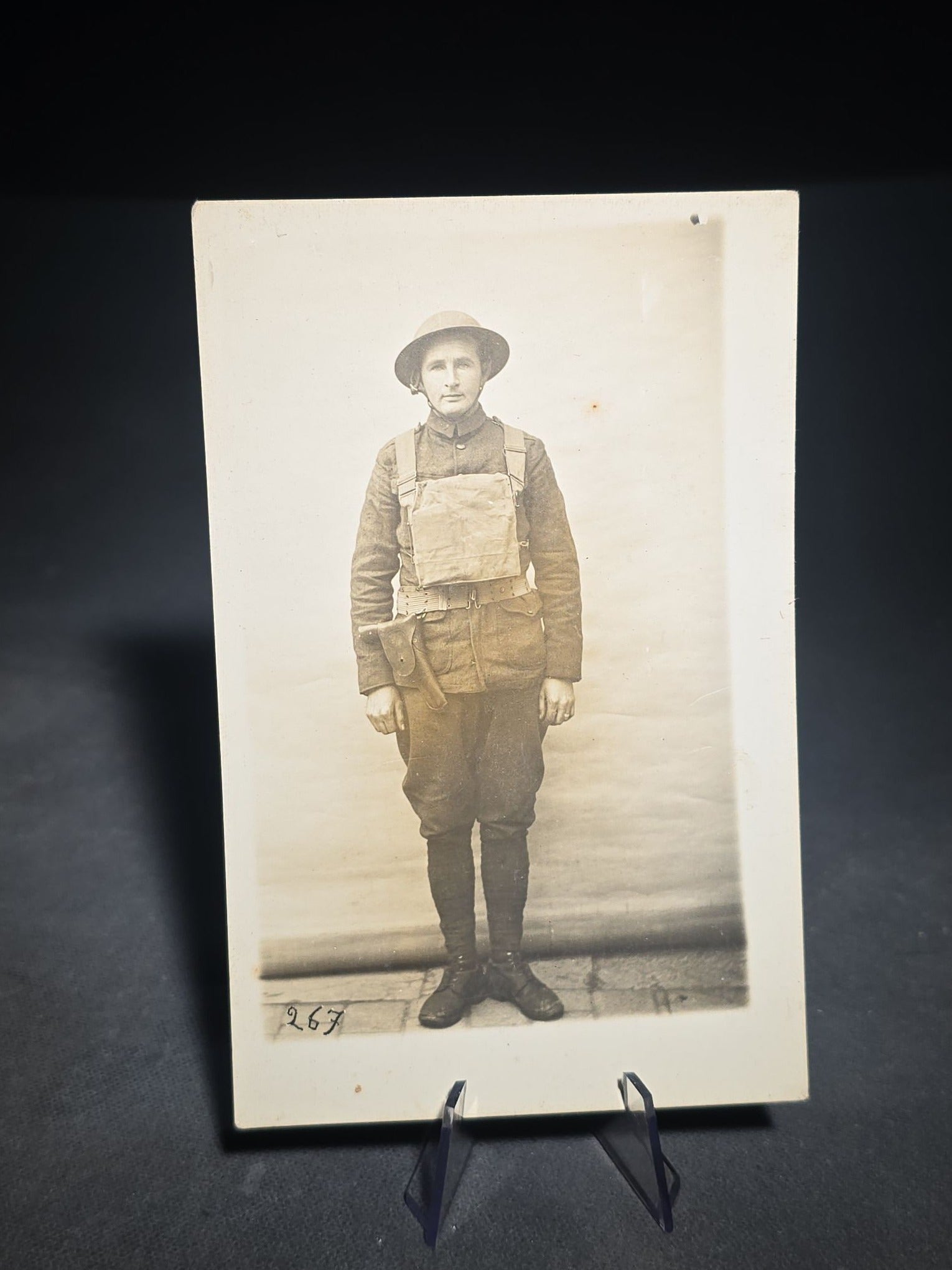 Grouping of Four Antique and Vintage Photographs including C.D.V. Family Portrait with Cat, WWI Soldier R.P.P.C., Board-Mounted Musicians with Violin and Banjo, and Snapshot of Child Cowboy