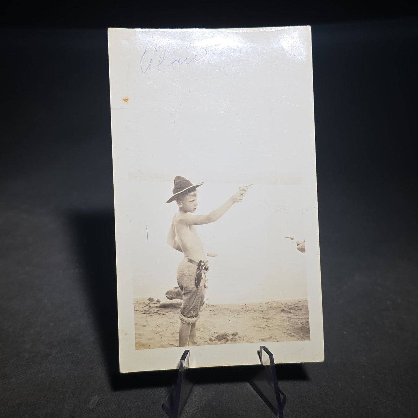 Grouping of Four Antique and Vintage Photographs including C.D.V. Family Portrait with Cat, WWI Soldier R.P.P.C., Board-Mounted Musicians with Violin and Banjo, and Snapshot of Child Cowboy