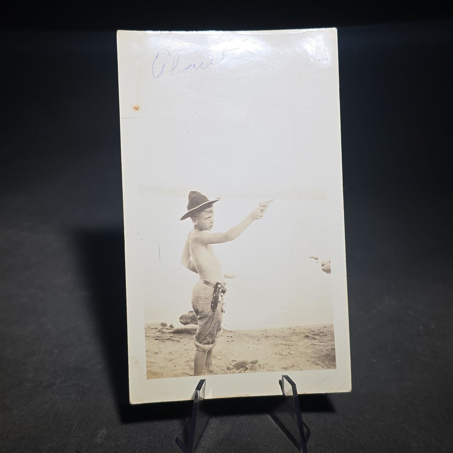 Grouping of Four Antique and Vintage Photographs including C.D.V. Family Portrait with Cat, WWI Soldier R.P.P.C., Board-Mounted Musicians with Violin and Banjo, and Snapshot of Child Cowboy