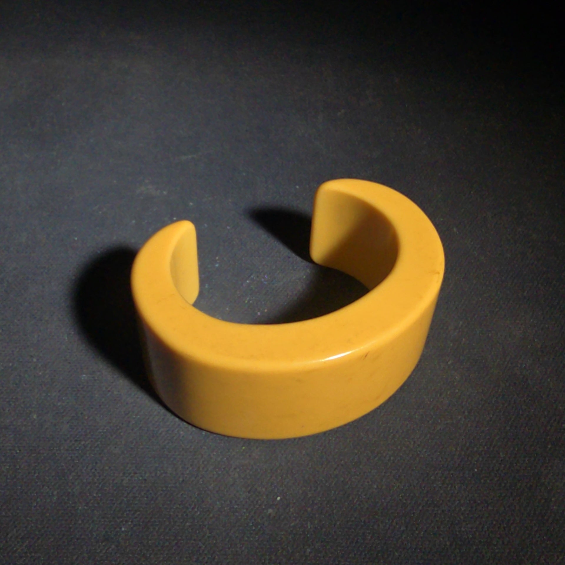 Pair of Antique Butterscotch Early Plastic Bangle Bracelets including Closed Bangle and Open Cuff
