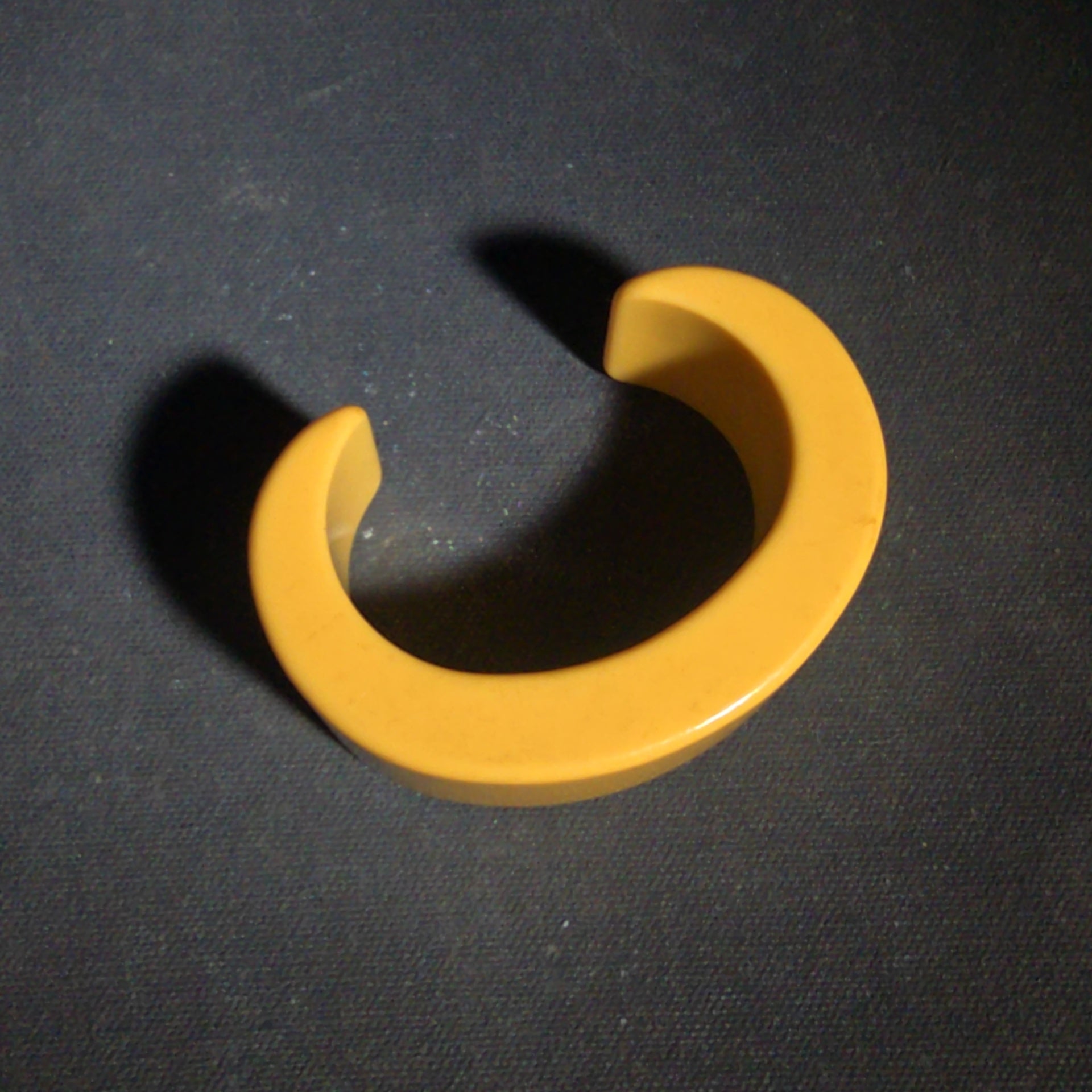 Pair of Antique Butterscotch Early Plastic Bangle Bracelets including Closed Bangle and Open Cuff