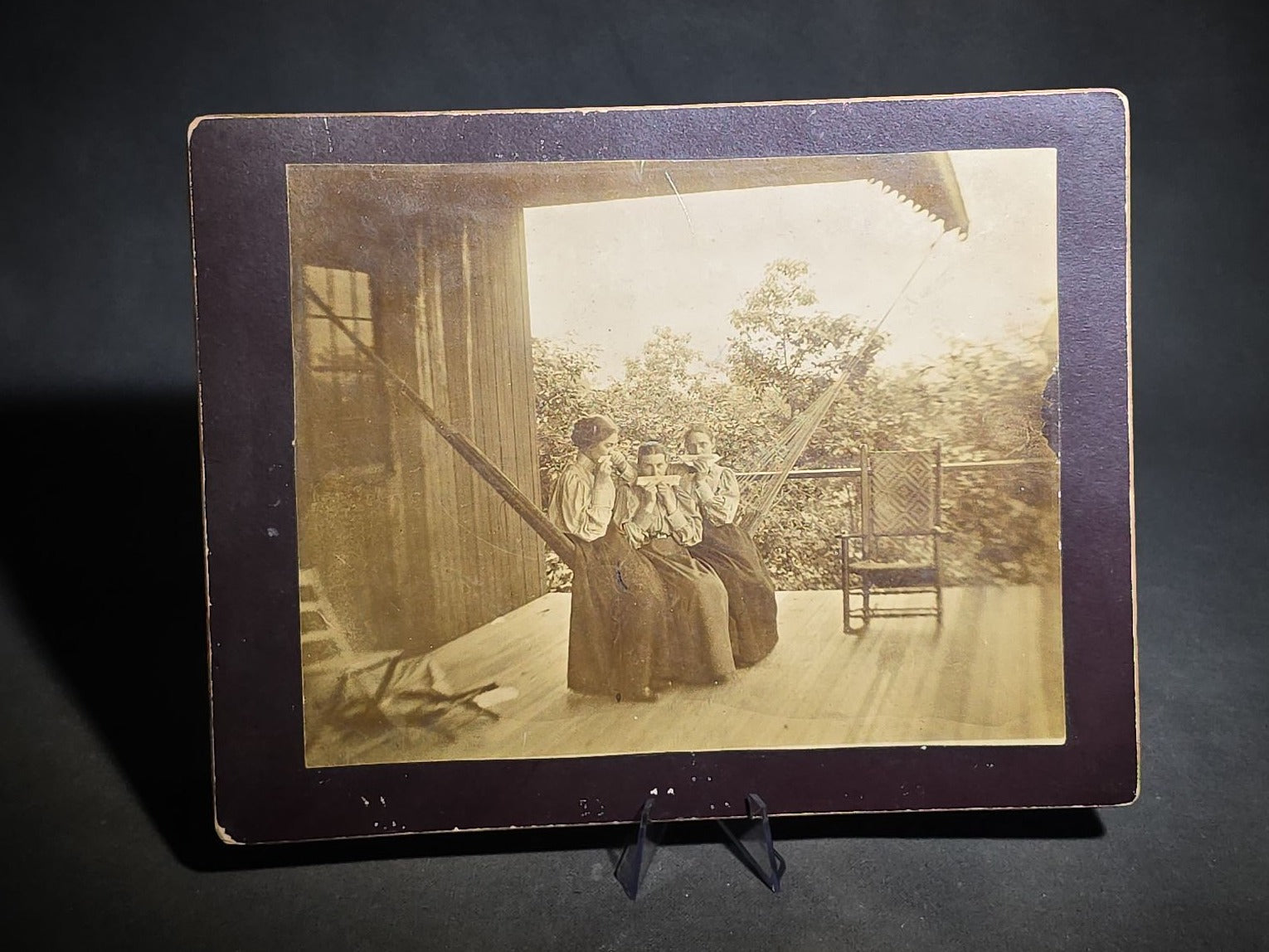 Grouping of Four Antique Photographs and Print including Embossed Photo Display with Five Portraits, Women Playing Combs with Manuscript Poem Verso, Boy in Native American Costume, and Little Red Riding Hood Engraving