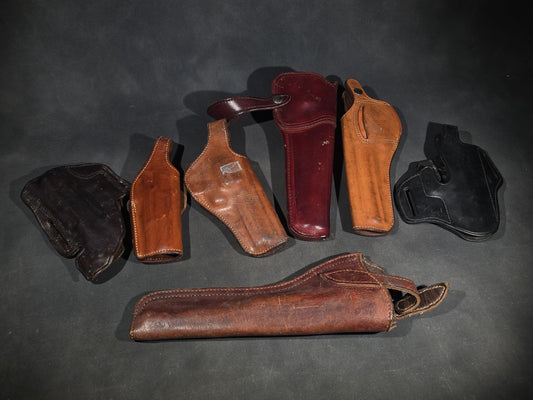 Grouping of Seven Vintage Leather Pistol Holsters including Bianchi #111 Cyclone and Interarms PHL-1