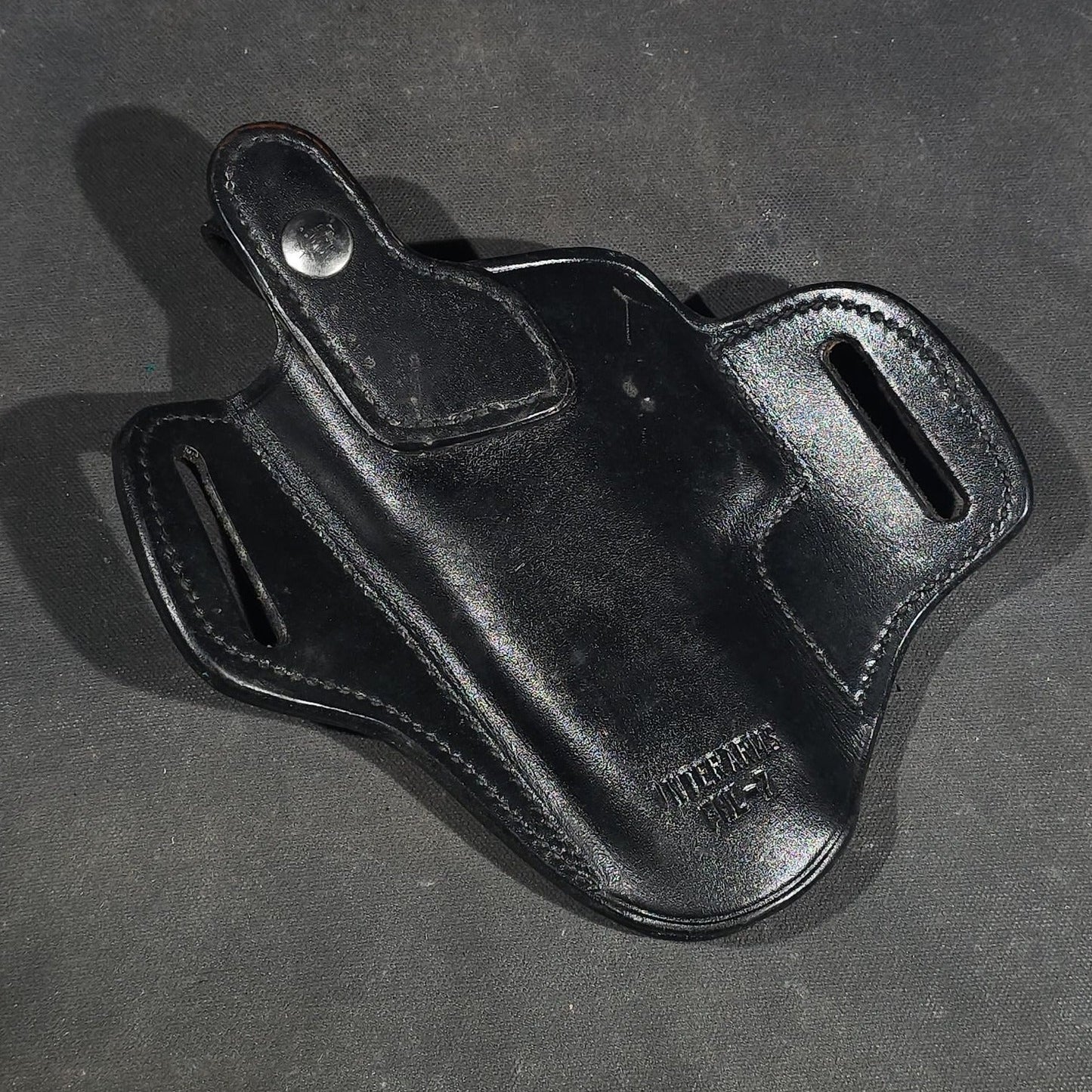 Grouping of Seven Vintage Leather Pistol Holsters including Bianchi #111 Cyclone and Interarms PHL-1