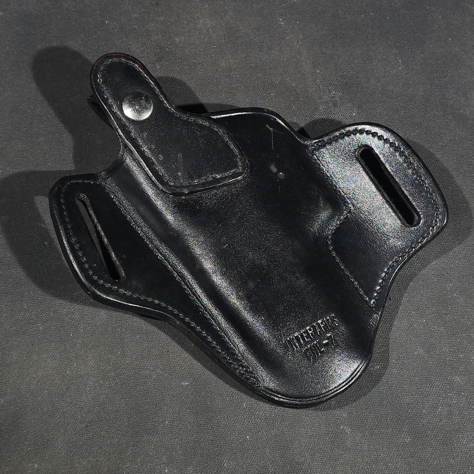 Grouping of Seven Vintage Leather Pistol Holsters including Bianchi #111 Cyclone and Interarms PHL-1