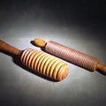 Lot 089 - Pair of Antique Turned Wooden Kitchen Utensils Including a Ridged Rolling Pasta Pin and a Ridged Single-Handle Masher or Butter Worker, 12" L each