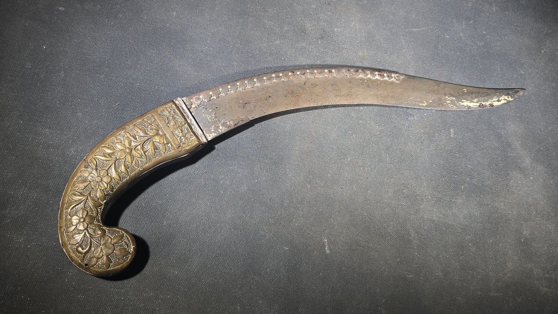 Antique Middle Eastern Curved Dagger with Floral-Decorated Handle