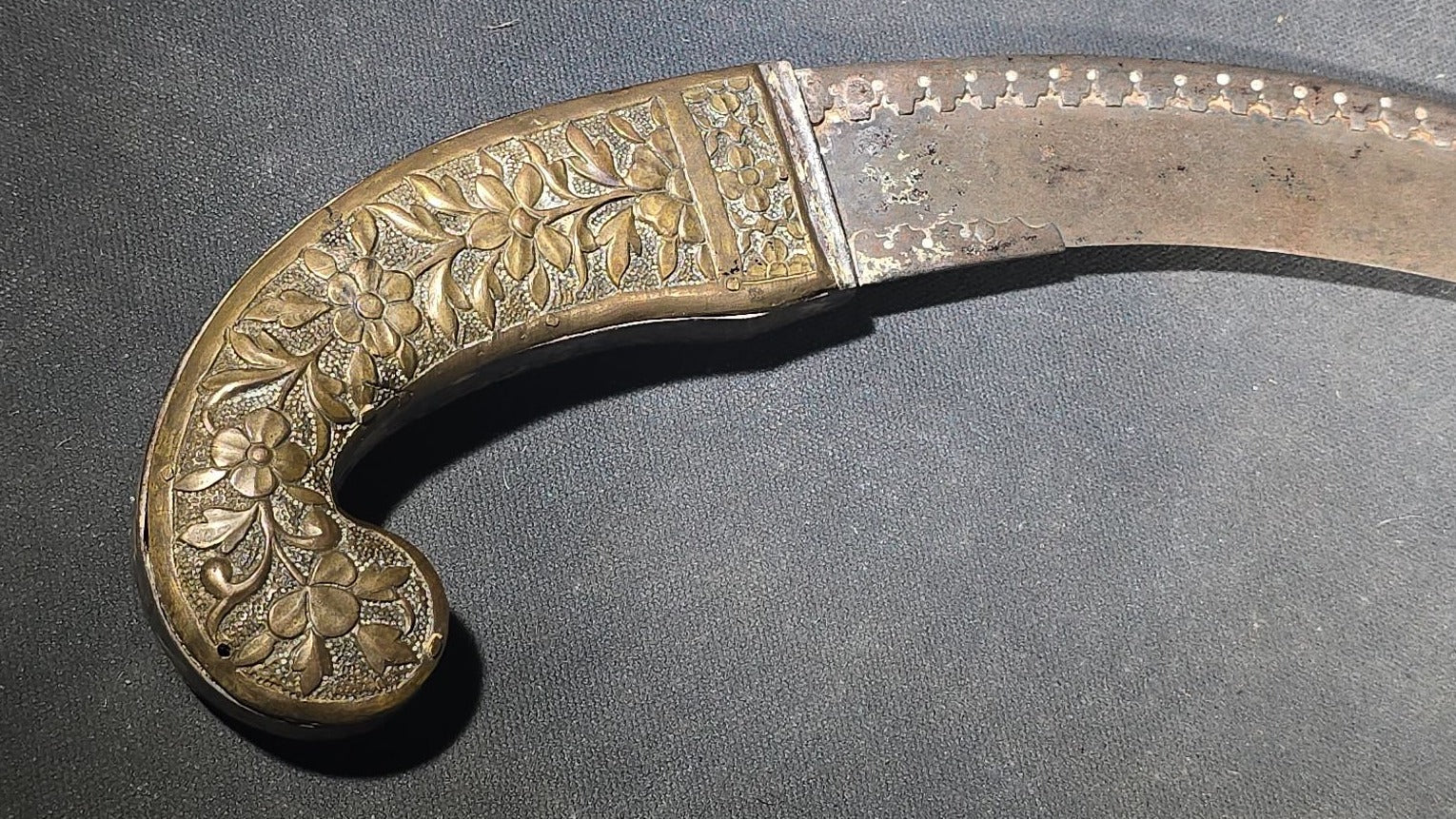 Antique Middle Eastern Curved Dagger with Floral-Decorated Handle