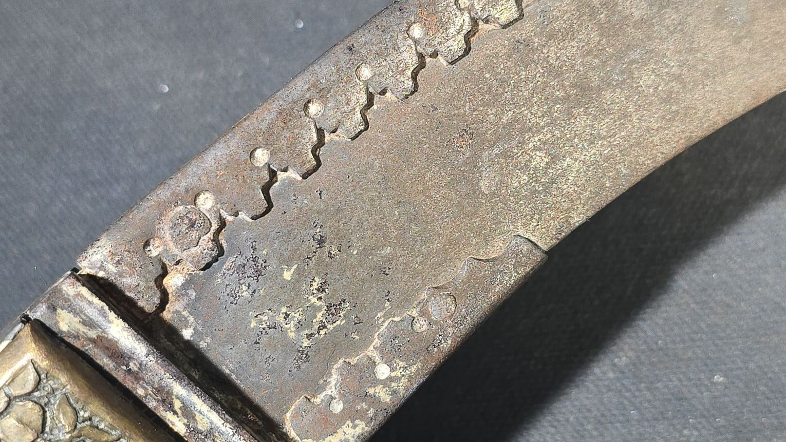 Antique Middle Eastern Curved Dagger with Floral-Decorated Handle