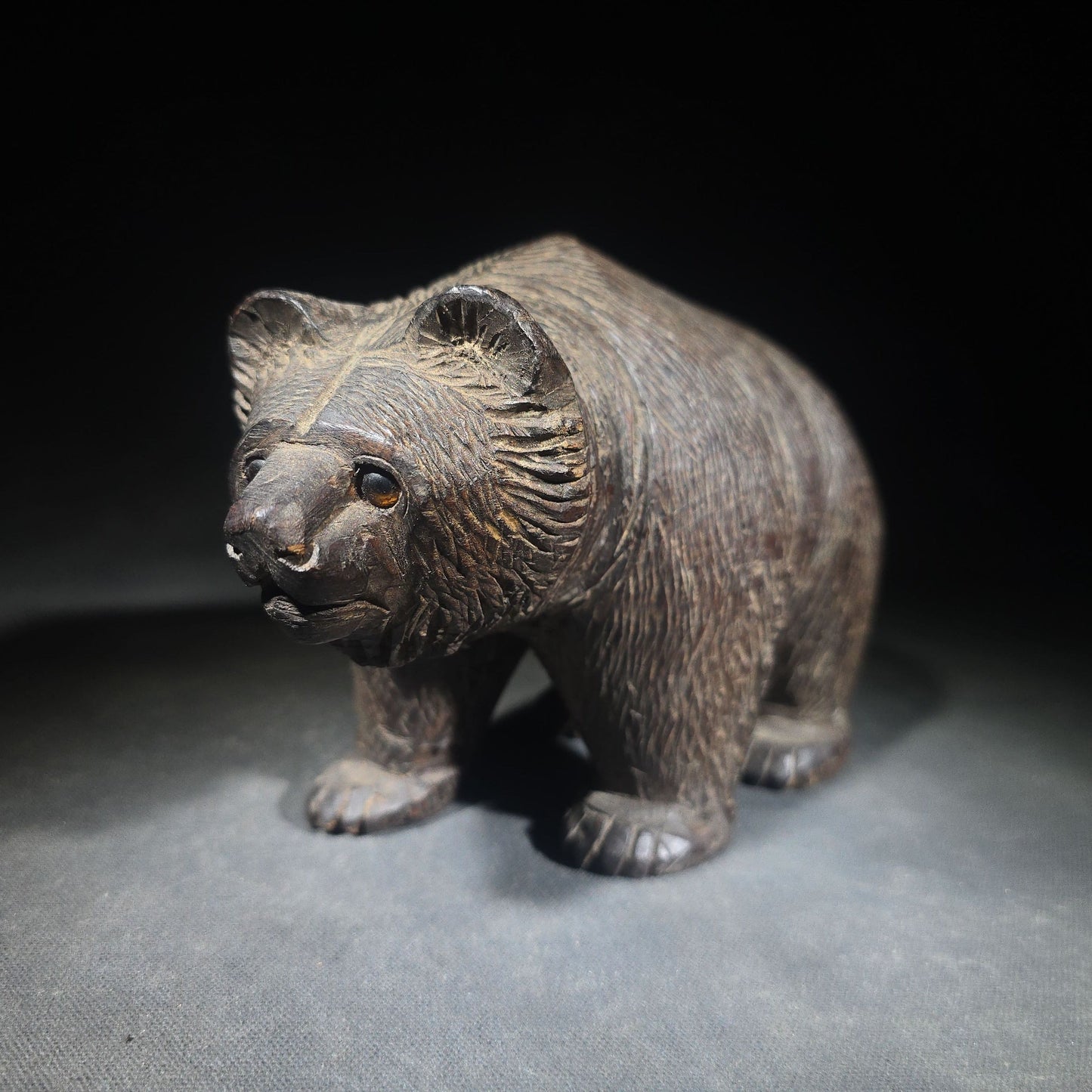 Vintage Carved Wood Bear Figure with Glass Eyes in Walking Pose