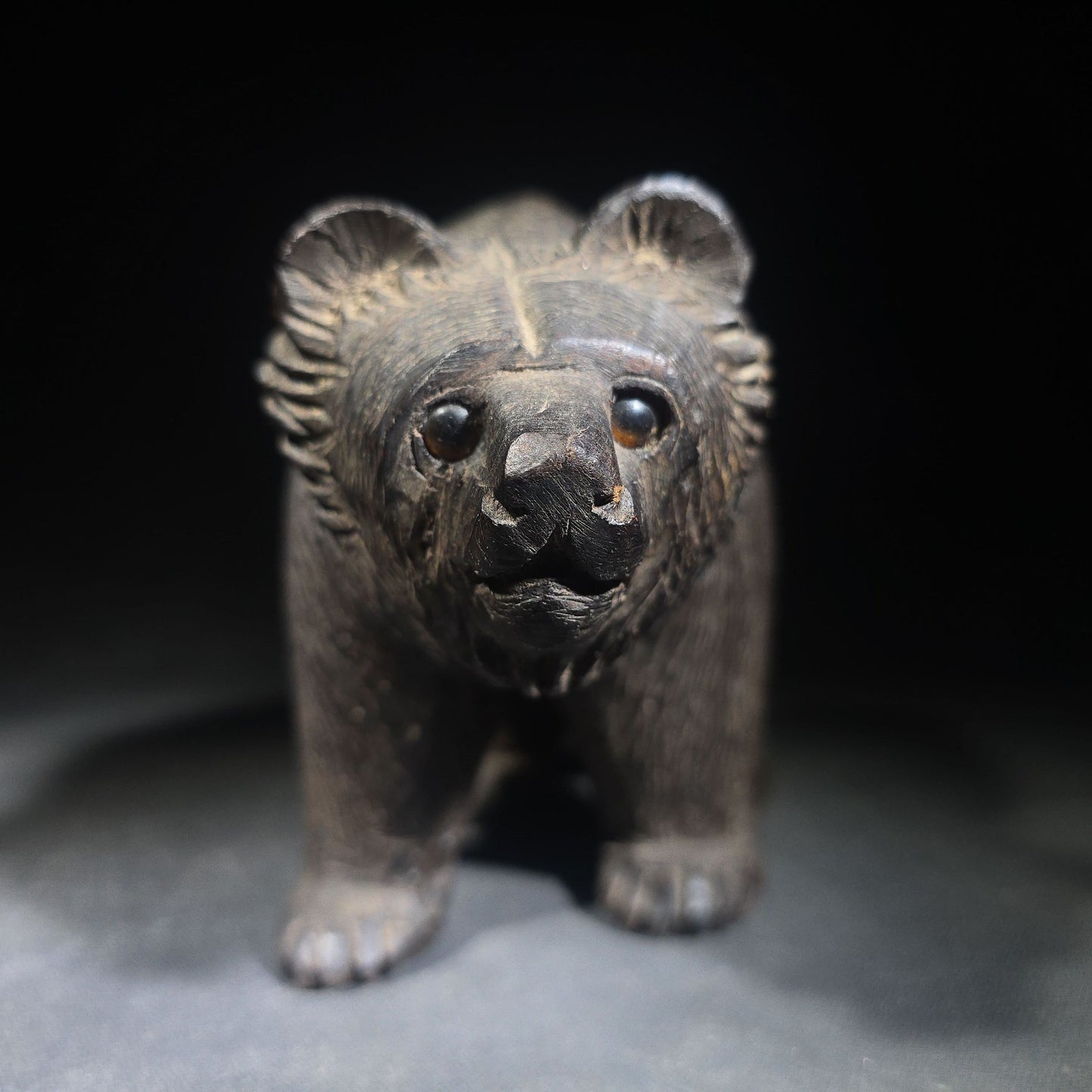Vintage Carved Wood Bear Figure with Glass Eyes in Walking Pose