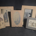 Lot 098 - Grouping of Five Antique and Vintage Board-Mounted Photographs Including Boy Holding a Box Camera, Two Men in Uniform, Family Eating Watermelon, and Dog Looking Out a Window, One Photographed by Rogers, New Haven, Connecticut