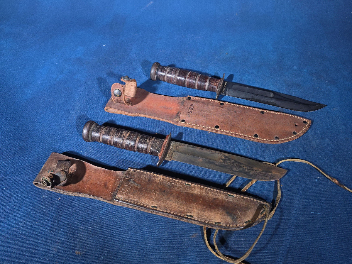 Pair of Vintage WWII U.S.N. Mark 1 Combat Knives with Leather Sheaths, Manufactured by Camillus and Robeson ShurEdge