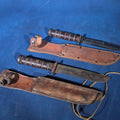 Lot 079 - Pair of Vintage WWII U.S.N. Mark 1 Combat Knives with Leather Sheaths, Manufactured by Camillus and Robeson Shuredge