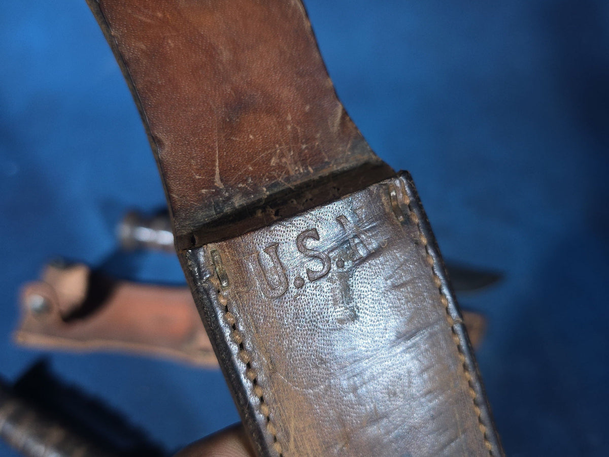 Pair of Vintage WWII U.S.N. Mark 1 Combat Knives with Leather Sheaths, Manufactured by Camillus and Robeson ShurEdge