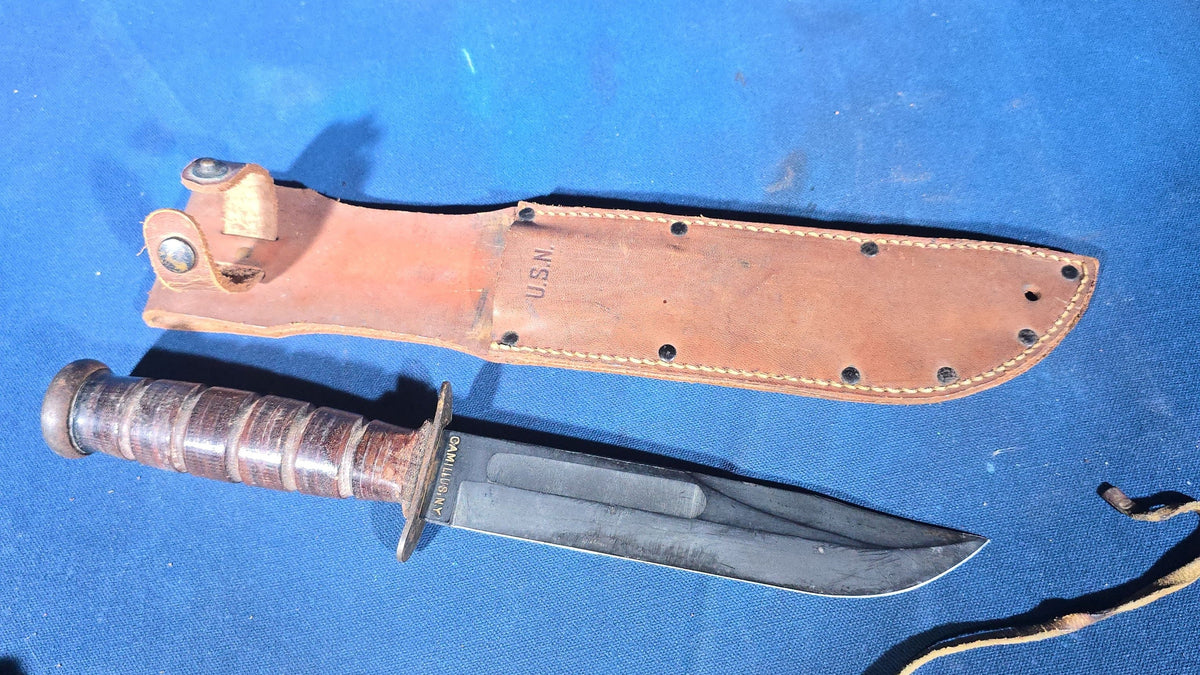 Pair of Vintage WWII U.S.N. Mark 1 Combat Knives with Leather Sheaths, Manufactured by Camillus and Robeson ShurEdge