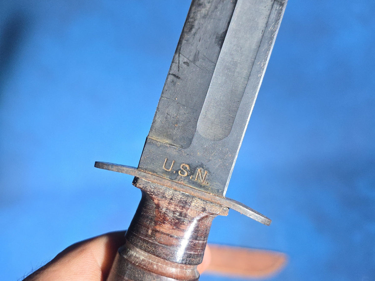Pair of Vintage WWII U.S.N. Mark 1 Combat Knives with Leather Sheaths, Manufactured by Camillus and Robeson ShurEdge