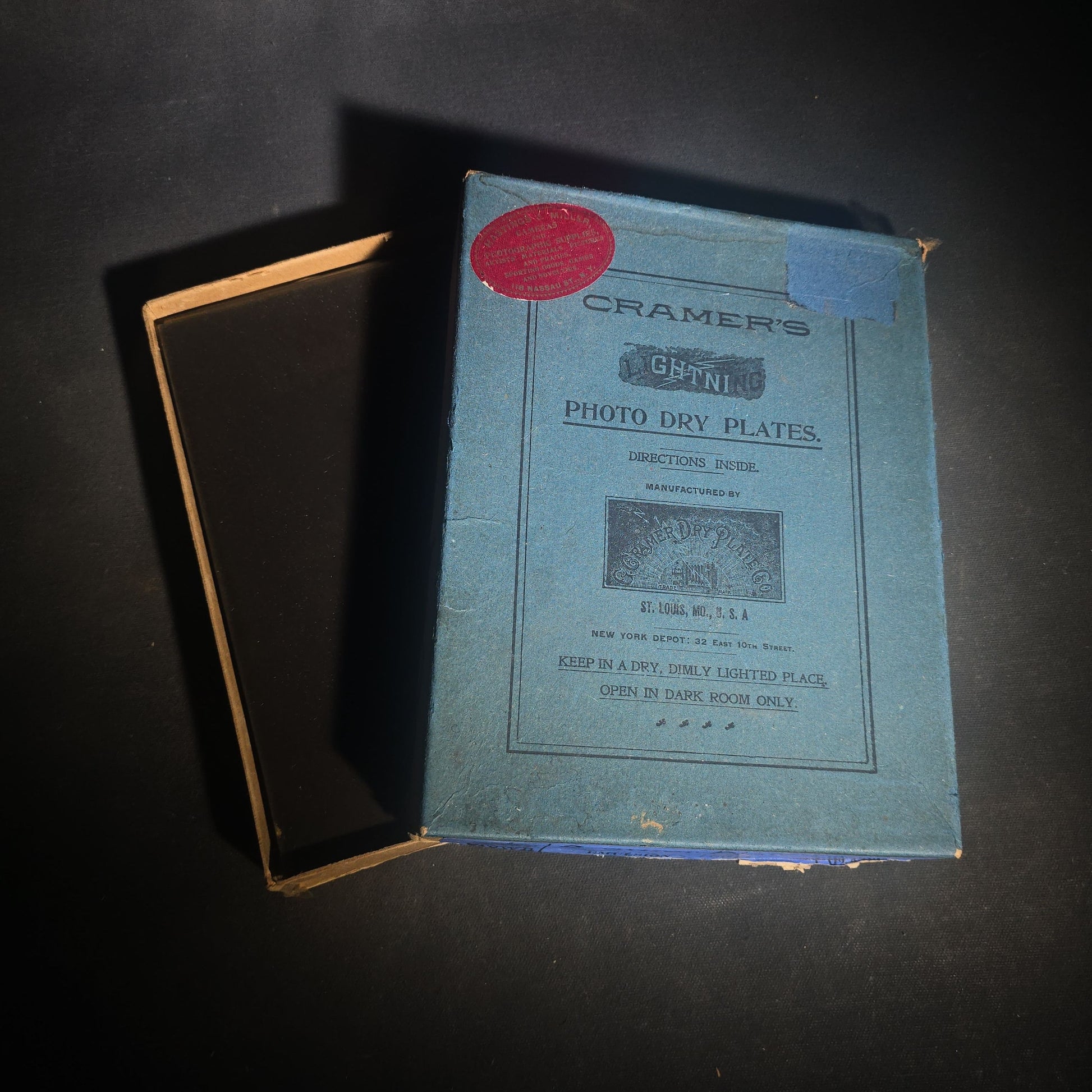 Grouping of 10 Antique Glass Plate Photographic Negatives in Cramer's Lightning Photo Dry Plates Box including Town Street Views, Man with Horse, and Residential Exteriors