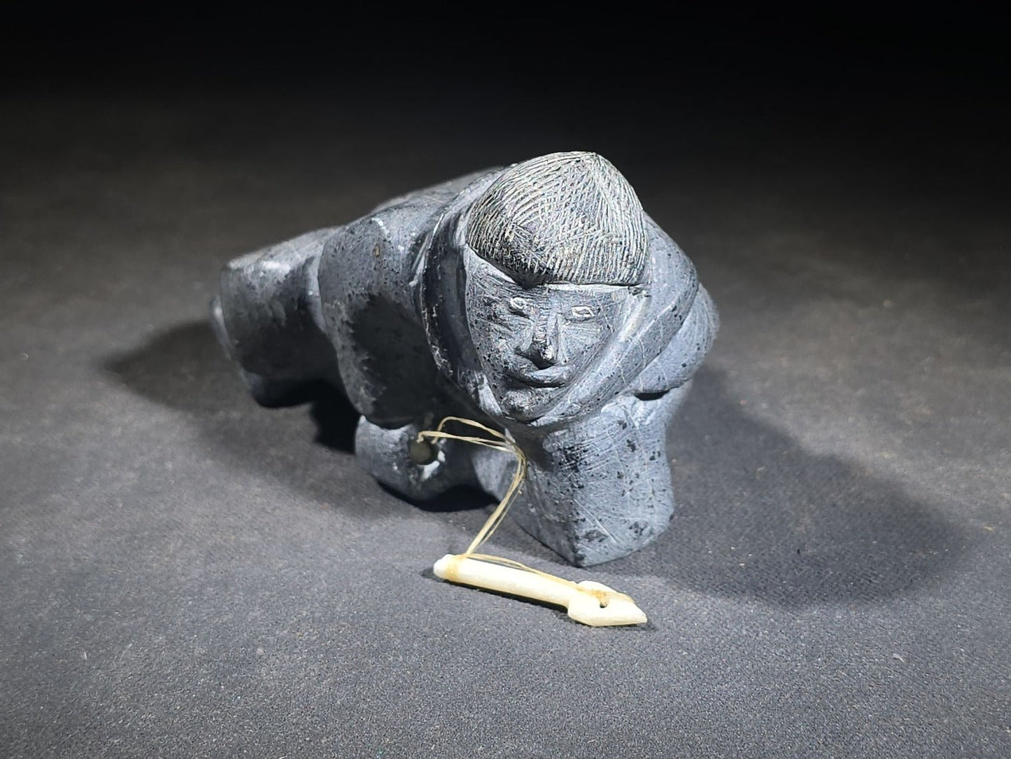 Vintage Inuit Soapstone Carving of a Prone Hunter with Bone Spear, Signed J. Muckpa, Note Spear Broken