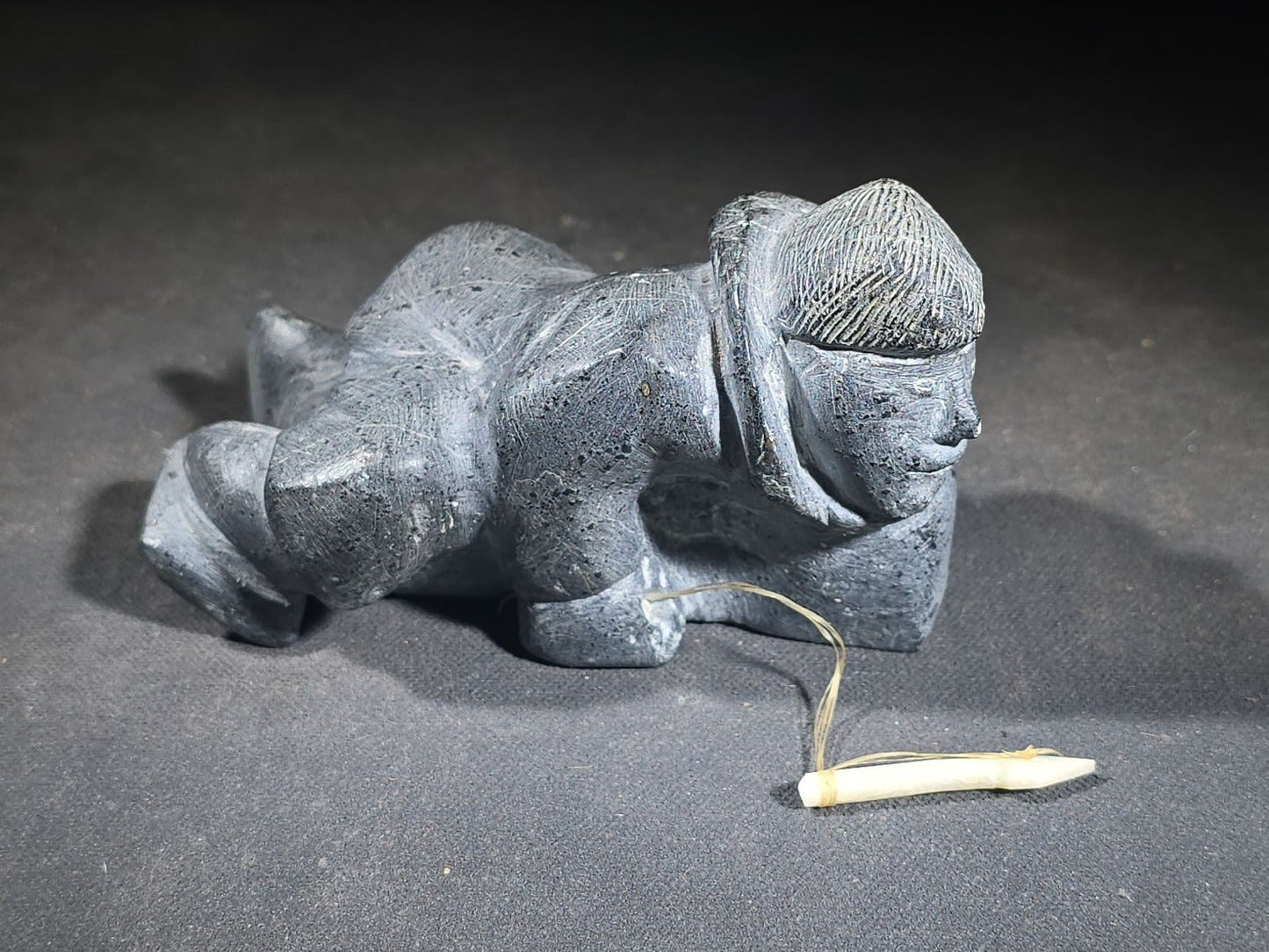 Vintage Inuit Soapstone Carving of a Prone Hunter with Bone Spear, Signed J. Muckpa, Note Spear Broken