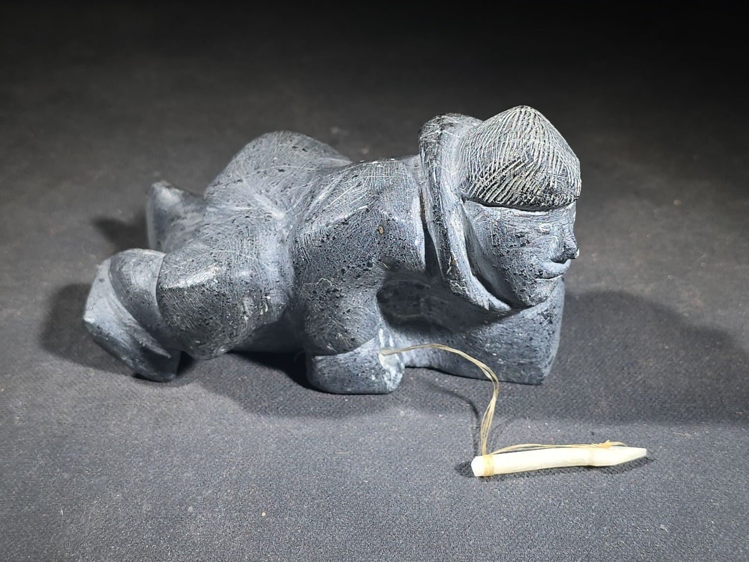 Vintage Inuit Soapstone Carving of a Prone Hunter with Bone Spear, Signed J. Muckpa, Note Spear Broken